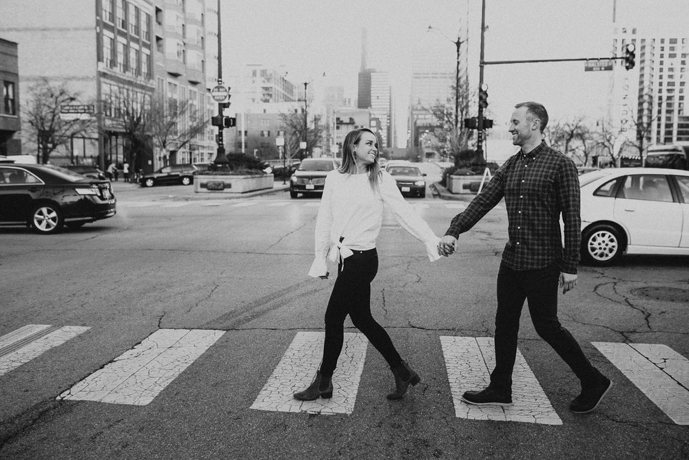  Couple crossing street in West Loop Chicago neighborhood 