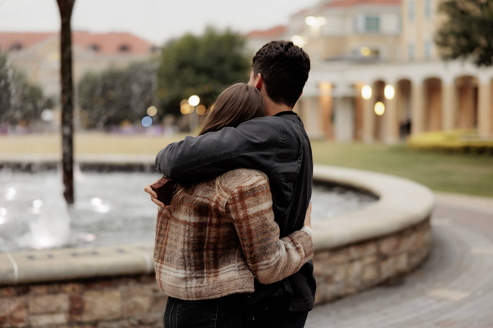 man and woman hugging | Texas Christian University Proposal