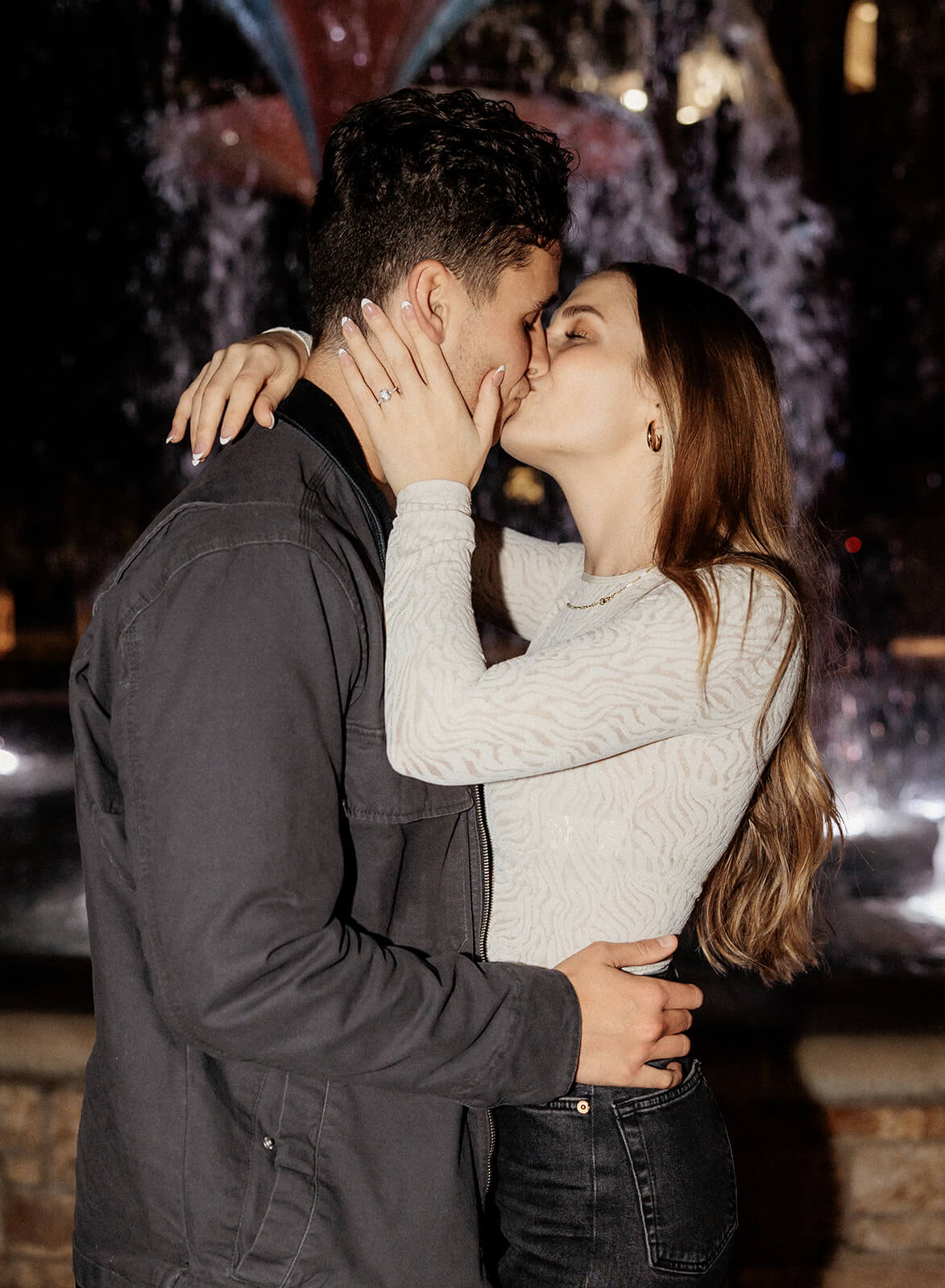 couple kissing in front of Frog Fountain | Texas Christian University Proposal