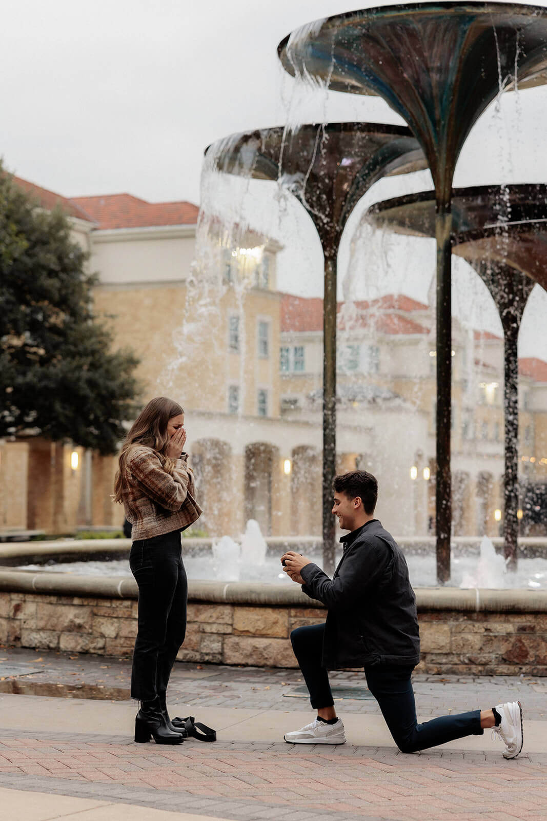 Man proposing to girlfriend in front of frog fountain | Texas Christian University Proposal