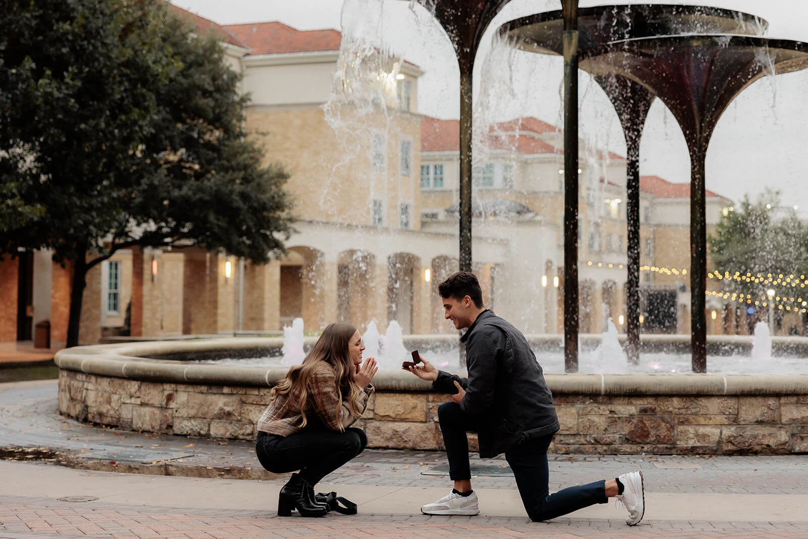 Man proposing to girlfriend in front of frog fountain | Texas Christian University Proposal