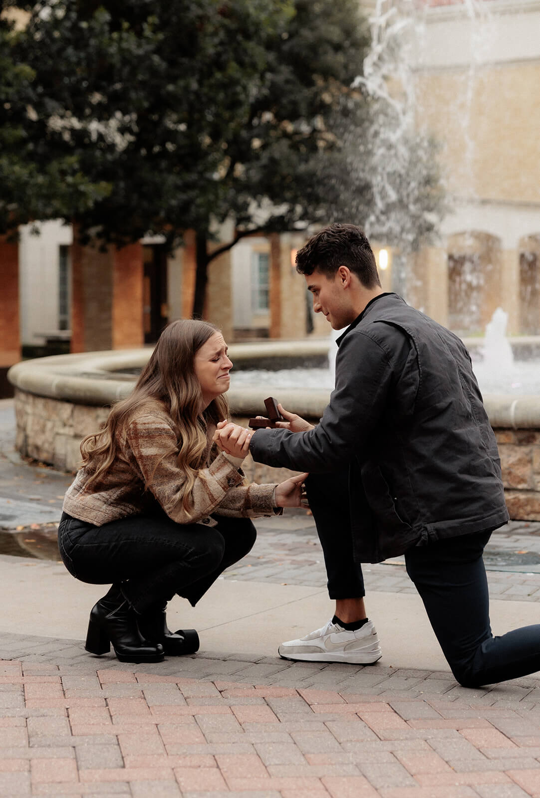 Man proposing to girlfriend in front of frog fountain | Texas Christian University Proposal