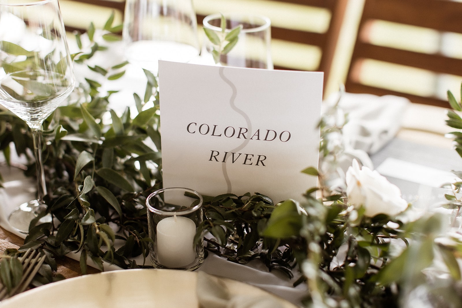 Wedding reception table with custom Montana river signs for table names