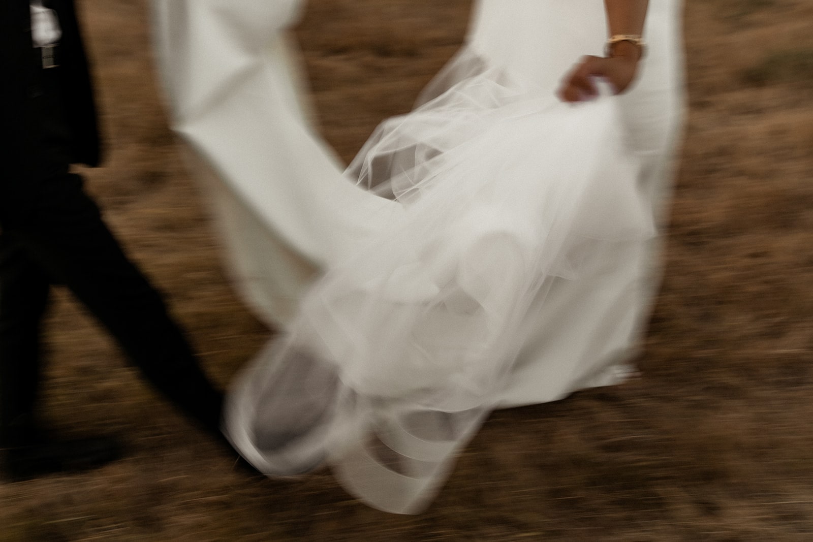 Bride and groom run through the field during sunset photos at Firelight Farm