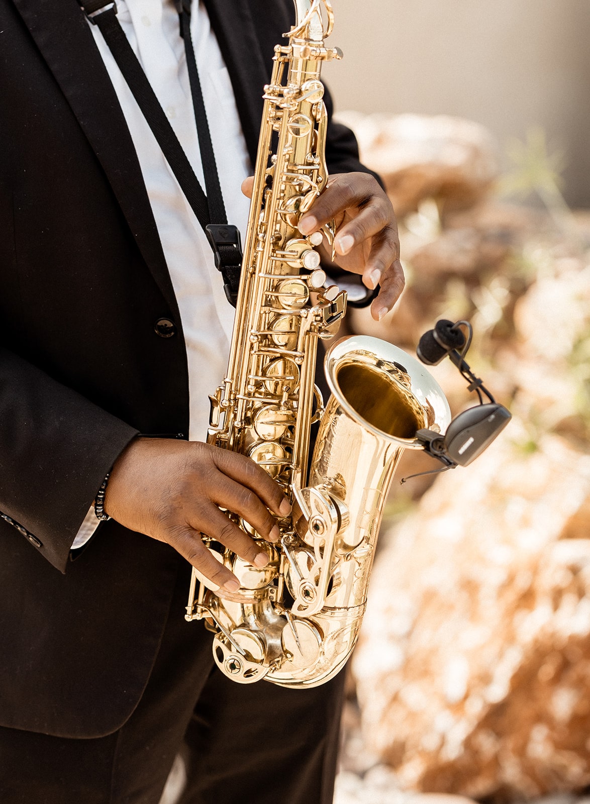 Saxophone player plays during outdoor wedding ceremony in Fort Worth, Texas