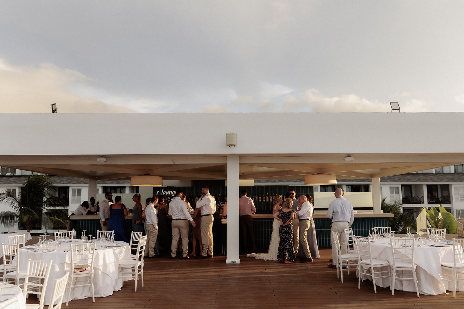 Guests mingle during cocktail hour at Excellence Oyster Bay resort