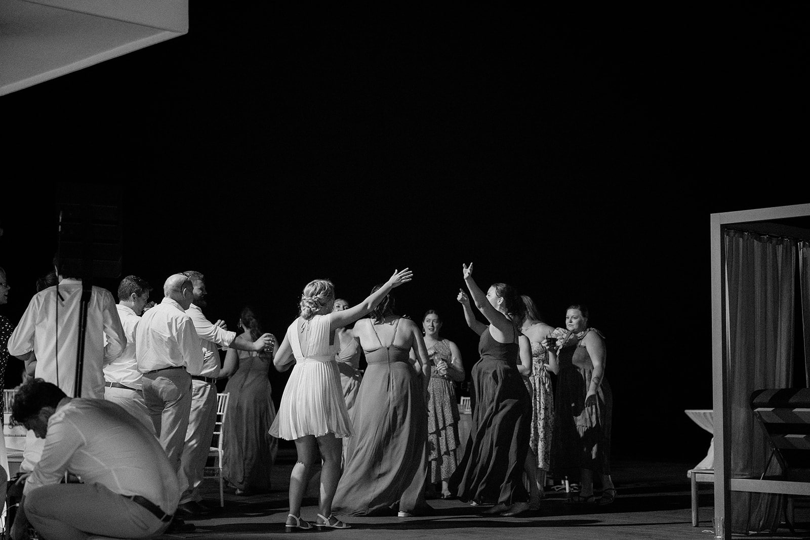 Bride dances with guests at the evening reception at her Montego Bay Jamaica wedding