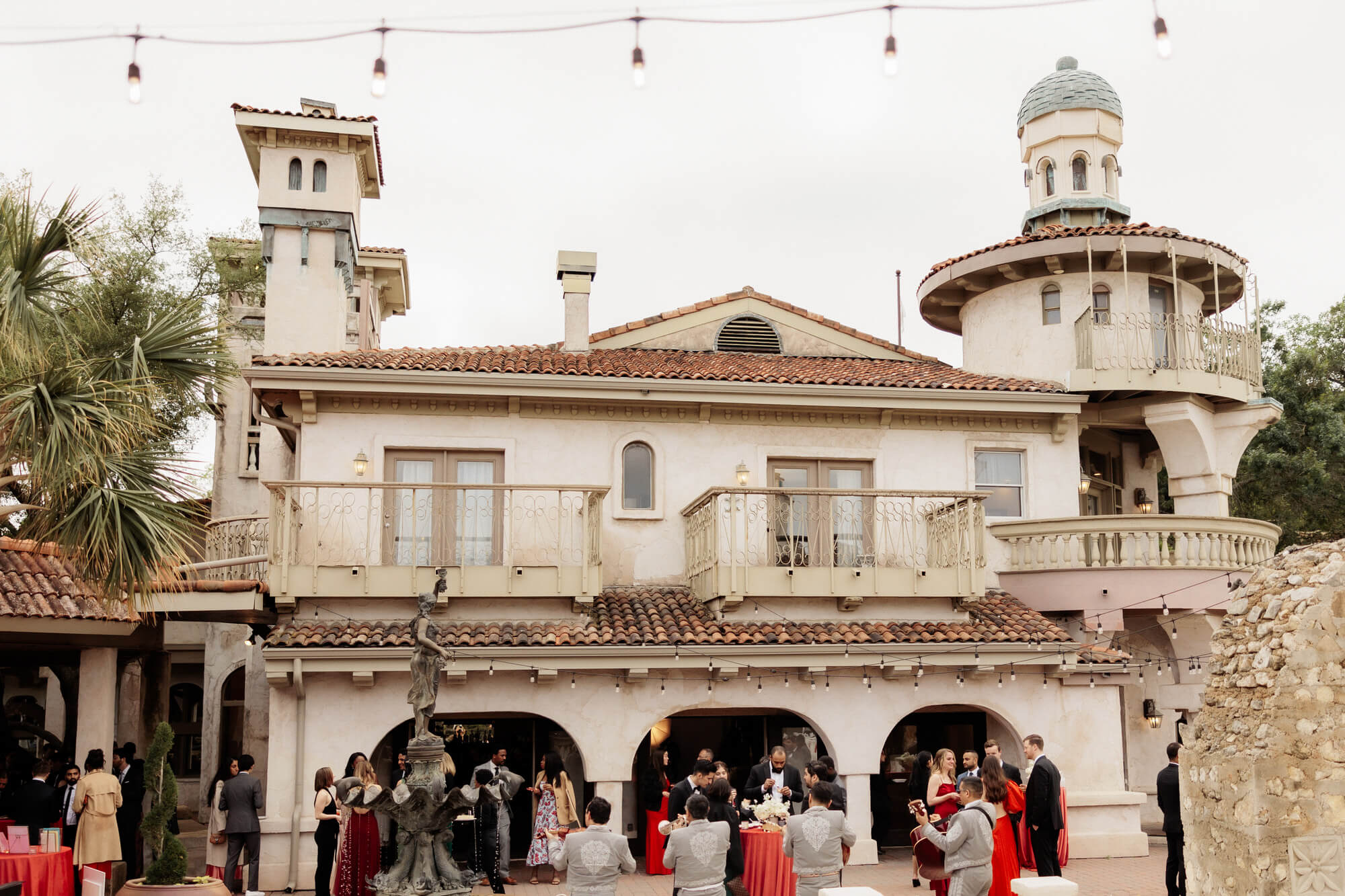 Guests mingle at a villa during an Italy wedding