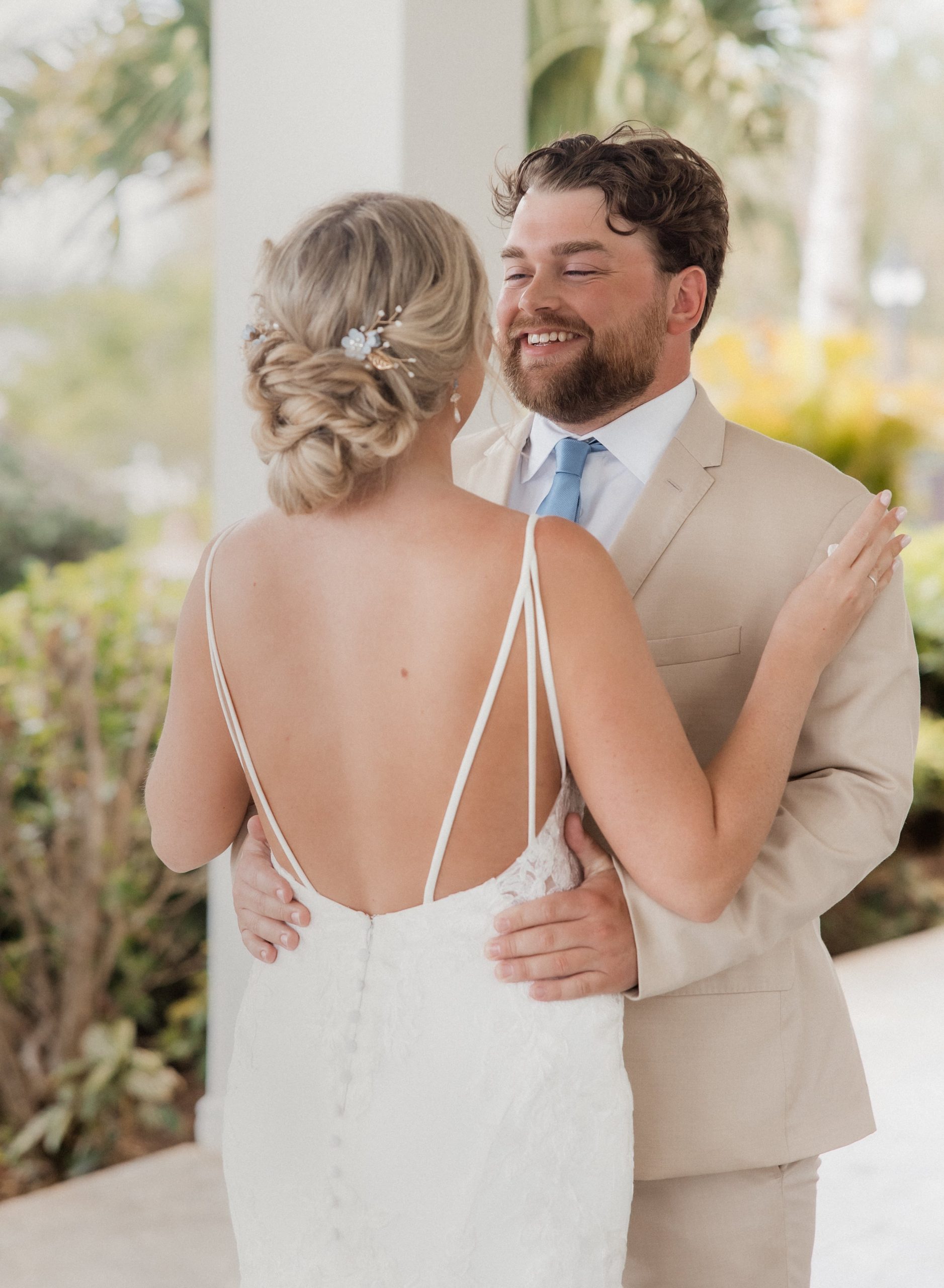 Groom smiles during first look with bride at their Jamaica destination wedding