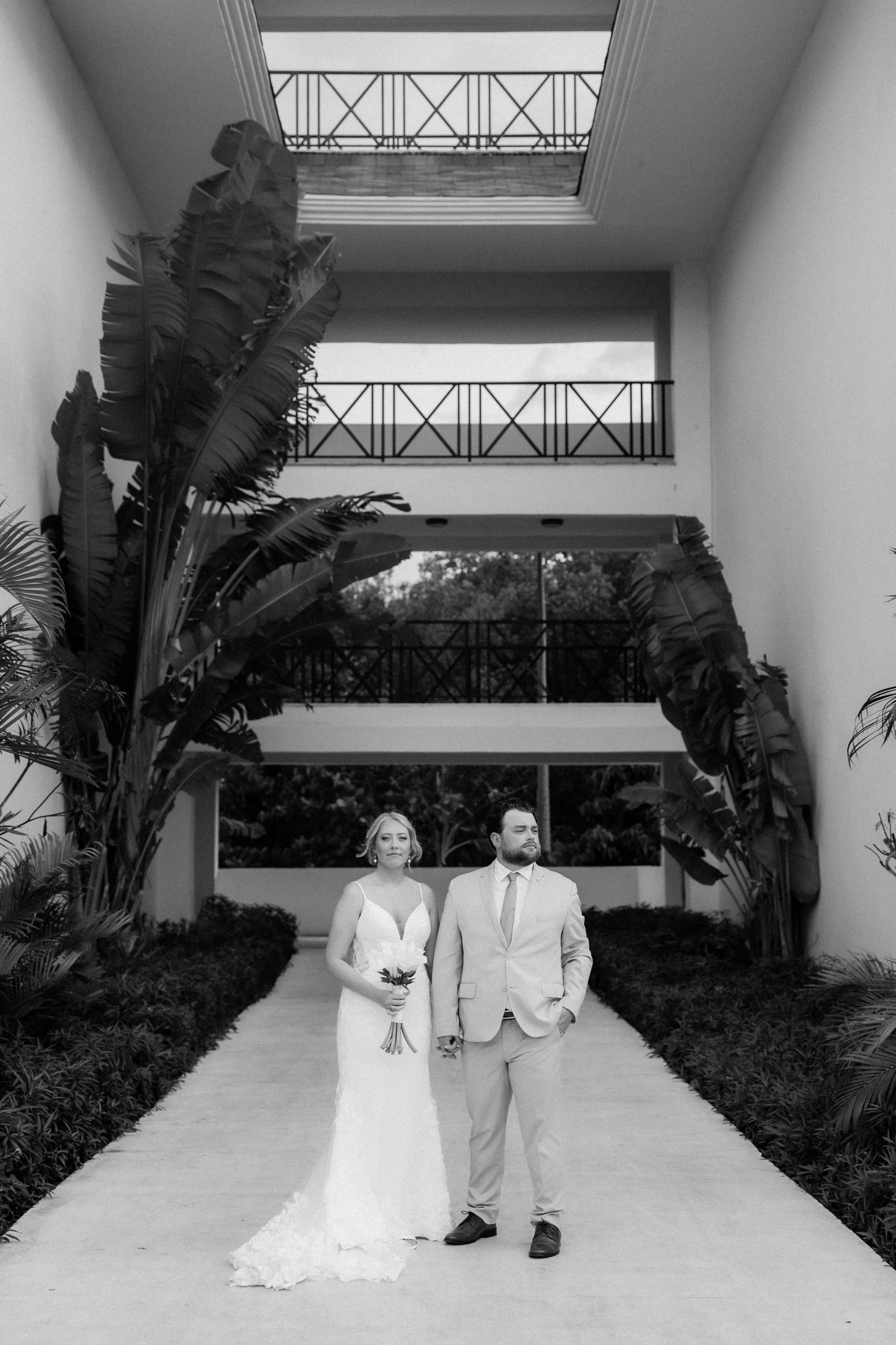 Bride and groom hold hands at their Montego Bay Jamaica wedding 