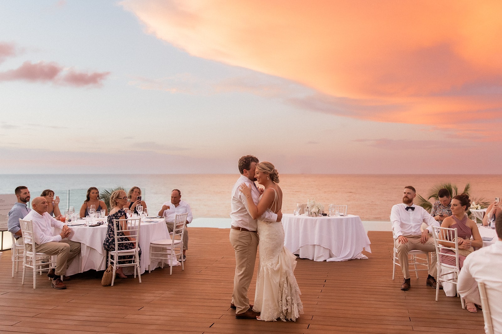 Bride and groom share a first dance at sunset at their Jamaica destination wedding