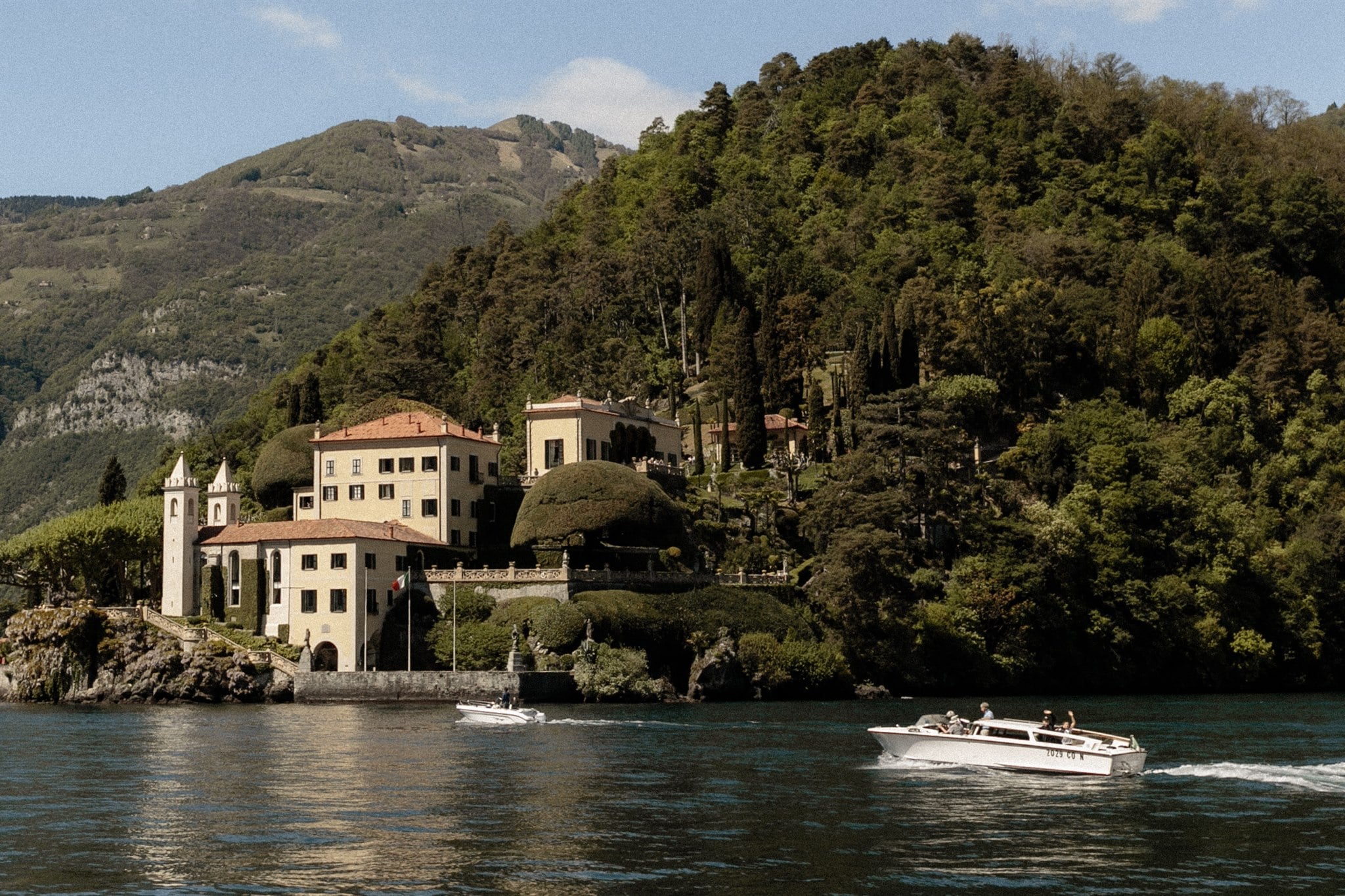 Boat gliding across the waters of Lake Como, Italy