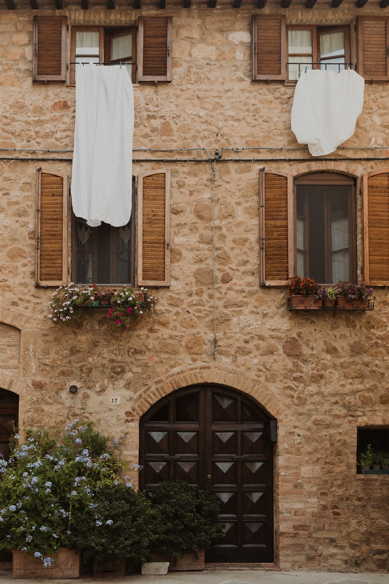 Sheets hanging from a window in Tuscany, Italy