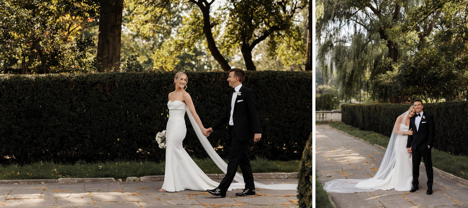 Bride and groom hold hands as they stroll around the garden during their Cleveland museum wedding photos