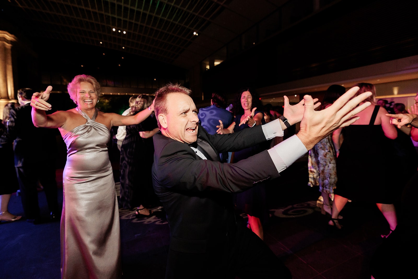 Guests dance on the floor during a museum wedding reception in Ohio